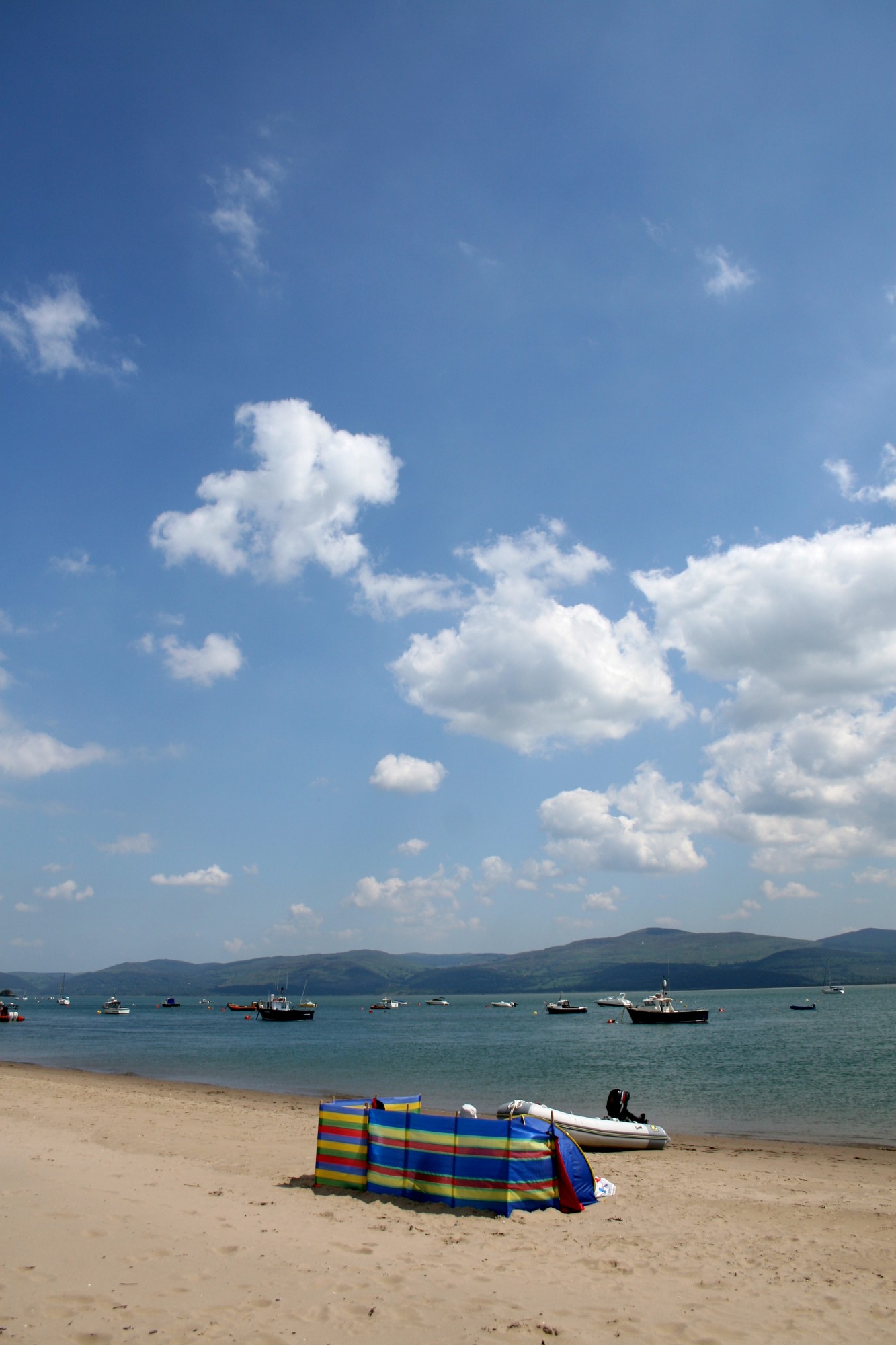 Sitting on Aberdovey beach with a wind break